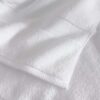 samifyhome-white-cotton-towel-texture-detail.jpg Close-up showing the soft plush texture and hem stitching of a Samifyhome cotton towel