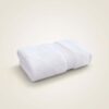 samifyhome-white-cotton-washcloth-face-towel.jpg Folded Samifyhome large white cotton bath towel with textured woven border