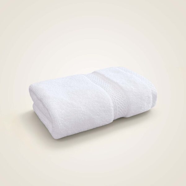 samifyhome-white-cotton-washcloth-face-towel.jpg Folded Samifyhome large white cotton bath towel with textured woven border
